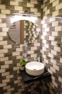 a bathroom with a sink and a mirror at The Cozy Flat 88m2 in Mytilini +35 photos