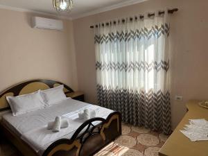 Ένα ή περισσότερα κρεβάτια σε δωμάτιο στο Canka Guest House