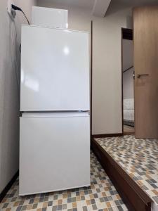 Η κουζίνα ή μικρή κουζίνα στο 遇見民宿