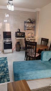 a living room with a couch and a table at شالية لاسرينا ميني ايجيبت ـ العين السخنة in Ain Sokhna