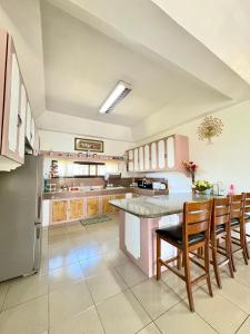 O bucătărie sau chicinetă la Villa de Flynn Private Resort