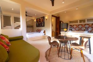 a living room with a couch and a table at Ocean Views Amazing Rooftop in Mazunte