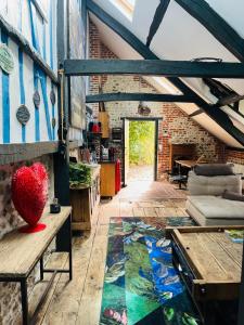 a living room with a red heart on the floor at La Petite Maison in Honfleur