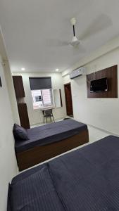 Ένα ή περισσότερα κρεβάτια σε δωμάτιο στο Karan Luxury CoLiving