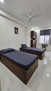 Ένα ή περισσότερα κρεβάτια σε δωμάτιο στο Karan Luxury CoLiving
