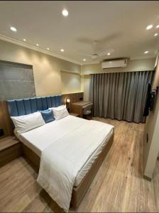 Katil atau katil-katil dalam bilik di Hotel the haveliya-1 mint from new delhi railway station & connaught place