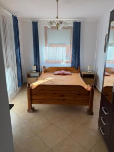 Postel nebo postele na pokoji v ubytování Hegyalja Apartmanház