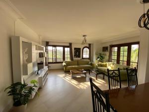 a living room with couches and a dining room at Villa Maadi 35 -R 303 -Double Room in Cairo