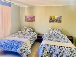 Postel nebo postele na pokoji v ubytování Hotel Khantati