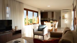 a living room with a couch and a table at Villa Moderna in Trairi