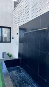 a swimming pool in the side of a house at شاليه الهنا in Jeddah