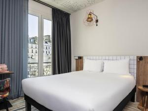 Postel nebo postele na pokoji v ubytování Ibis Styles Hotel Paris Gare de Lyon Bastille