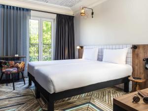 Postel nebo postele na pokoji v ubytování Ibis Styles Hotel Paris Gare de Lyon Bastille + 47 fotografií