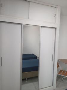 En eller flere senge i et værelse på Kitnet 203