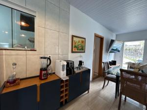 a kitchen with a counter with a blender on it at House in Santo Antônio in Florianópolis