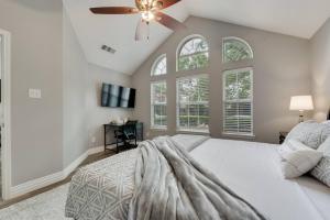 a bedroom with a white bed and a ceiling fan at Updated, Comfortable, And Quiet Space! in Trinity Mills