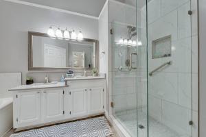 a bathroom with a shower and a sink and a mirror at Updated, Comfortable, And Quiet Space! in Trinity Mills +28 photos