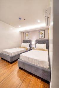 Ένα ή περισσότερα κρεβάτια σε δωμάτιο στο Everyone Hotel