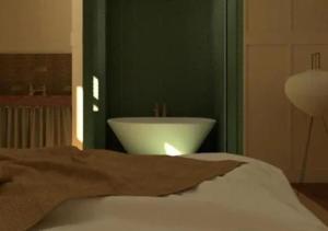 a bedroom with a white sink in a green wall at Winnedumah Hotel in Independence