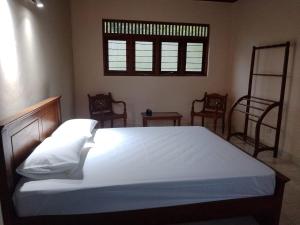 Katil atau katil-katil dalam bilik di Amara Garden Villa +8 gambar