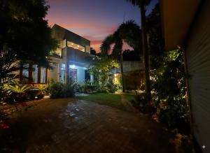 a house at night with the lights on at Hotel Halona in Kandy