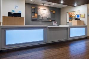 a store counter with two blank signs on it at Holiday Inn Express and Suites N Myrtle Beach Little River in Little River