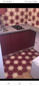 a kitchen with a sink and a stove in it at Casa Fabrizio Ai Gradoni Di Chiaia in Naples