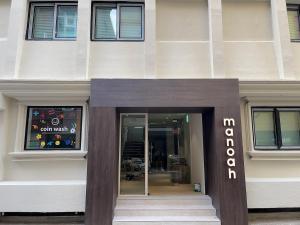 a building with the entrance to a store at Busan manoah stay hotel in Pusan