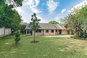 a house with a tree in the yard at Shai in Johannesburg