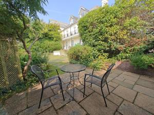 a table and two chairs and a table and chairs at 1 Bed in Fowey oc-p33360 in Fowey