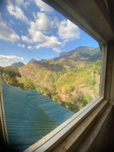 ein Fenster mit Bergblick in der Unterkunft UNDE Village Camp Morogoro in Morogoro