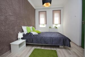 Posteľ alebo postele v izbe v ubytovaní Cozy Apartment