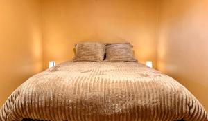 Postel nebo postele na pokoji v ubytování La Ferme des Roses