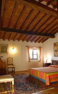 A bed or beds in a room at B&B La Collina