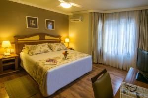Cama ou camas em um quarto em Hotel Recanto da Serra