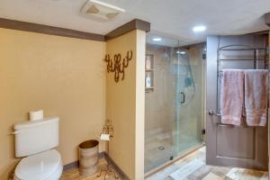 a bathroom with a toilet and a shower at Stay and Sip Group Ranch at Shamrock Hills Vineyard in Excelsior Springs +36 photos