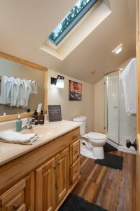 a bathroom with a sink and a shower and a toilet at 2 Bedroom Loft on Horse, Goat, Donkey and Cow Farm in Bozeman