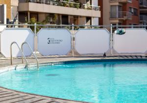 a large swimming pool with a bird sitting on top of it at Hotel Cristoforo Colombo in Buenos Aires