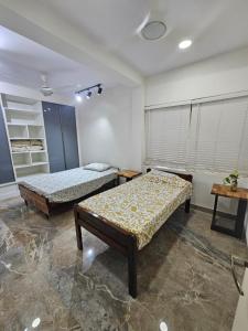 Postel nebo postele na pokoji v ubytování Ashirwad Homestay