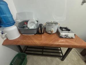 a table with a blender and a toaster on it at Solara Holiday Homes in Anuradhapura