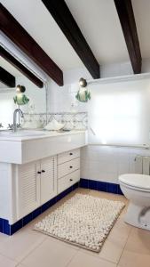 a bathroom with a sink and a toilet at Villa Blue beach Tabarca in Tabarca +38 photos