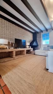 a living room with a large flat screen tv at Villa Blue beach Tabarca in Tabarca