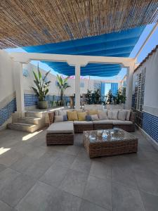 a living room with couches and a blue ceiling at Villa Blue beach Tabarca in Tabarca