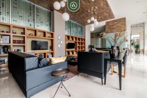 Televisyen dan/atau pusat hiburan di Redesigned 1BR Condo in Polanco - Pool Gym & Padel