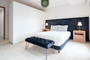 Katil atau katil-katil dalam bilik di Redesigned 1BR Condo in Polanco - Pool Gym & Padel