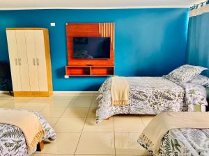 Postel nebo postele na pokoji v ubytování Hotel Khantati