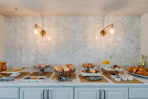 a buffet with many different types of bread and pastries at White House Napa in Napa +145 photos