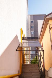 a stairway leading up to a building at AMBER Studio in Craiova