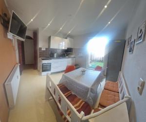 a kitchen and dining room with a table and chairs at Monteurwohnung 2 Vollumen in Redwitz an der Rodach