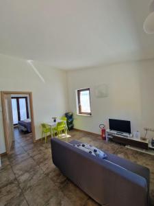 a living room with a couch and a table at La Casa in Campagna in Ferrazzano